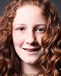 photo of a smiling teenage girl with braces